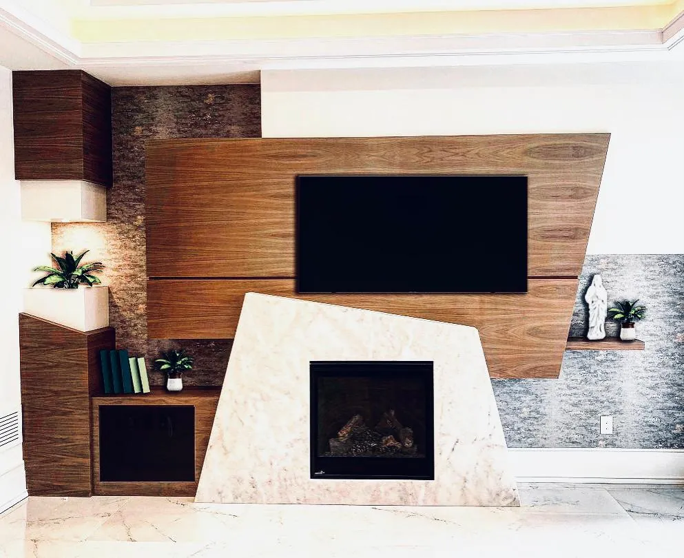 Angled walnut panel behind a television above a sculpted marble fireplace
